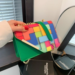 Green crossbody bag with colorful geometric patchwork and gold chain strap