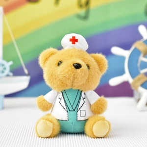 Detailed view of a plush teddy bear wearing a white doctor's coat and nurse hat
