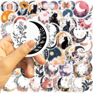 Detail of moon-shaped floral sticker with monochrome botanical patterns for DIY decoration