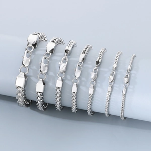 Detail view of various widths of silver stainless steel Franco chain bracelets for men