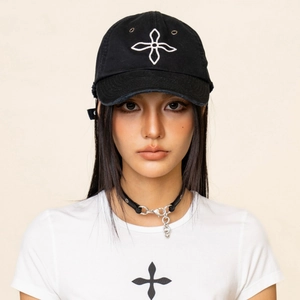 Distressed black baseball cap with white cross embroidery and matching street style graphic t-shirt