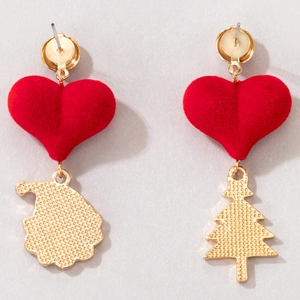 Detail of asymmetrical red flocked heart earrings with gold Santa and Christmas tree pendants