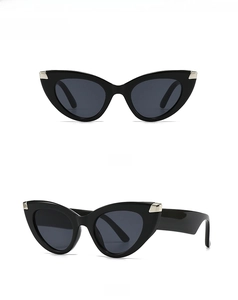 Front and 45-degree side views of black cat-eye sunglasses with metal accents