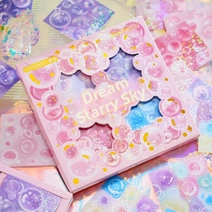 Macro detail of Starry Dream vintage scrapbook paper with 100 non-repeating gold foil stickers
