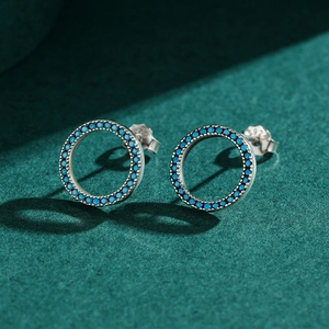 S925 sterling silver hollow round stud earrings featuring turquoise pave setting