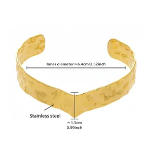 Detail view of 18k gold plated stainless steel cuff with hammered texture and V-shape design
