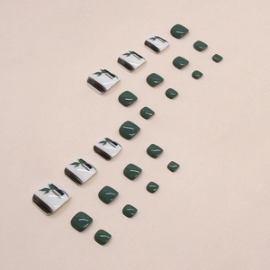 Dark green and white leaf pattern press-on toenails with glossy finish for women