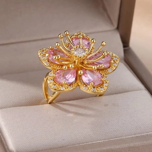 Exquisite gold floral ring with pink zircon petals and sparkling accents in a gift box