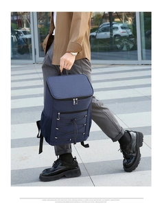 Model wearing navy insulated backpack with reflective strip for outdoor picnic and camping