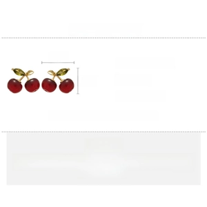 Detailed macro view of red cherry earrings with gold leaves and green zircon insets