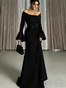 Elegant off-shoulder long sleeve black evening gown with flared sleeves and mermaid silhouette