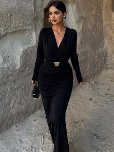 Elegant black long sleeve V-neck maxi dress with ruched waist and metallic buckle detail