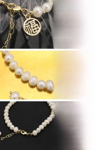 Detailed view of natural freshwater pearl bracelet with 18K gold-plated Fu pendant