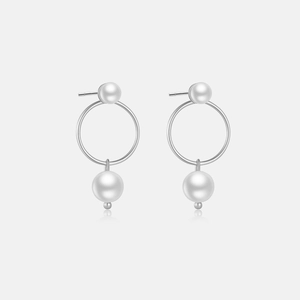 Detail view of 925 sterling silver hoop earrings with dual white pearls and pin design