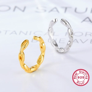 Close-up of 925 sterling silver twist chain ring in gold and silver finishes