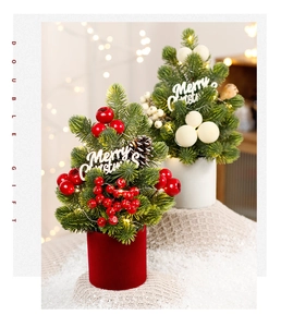 Mini Christmas trees with pine cones and red berry decor on faux snow base