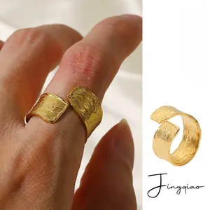 Macro view of 18K gold PVD plated stainless steel ring with unique textured surface