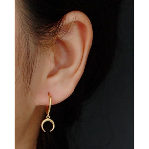 S925 sterling silver crescent moon drop huggie earrings in gold plating worn by model