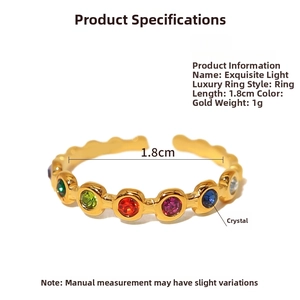Detailed view of gold open ring featuring six colorful crystals and 1.8cm diameter