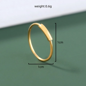 Detail shot of 1cm golden U-shaped nose ring with 0.6g weight specification