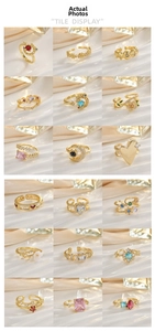 Collection of gold rings featuring heart and moon designs with colorful zircon inlay