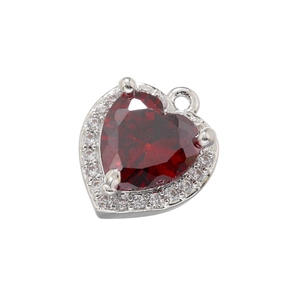 Macro shot of 18K gold plated heart pendant with red zircon and crystal halo detail