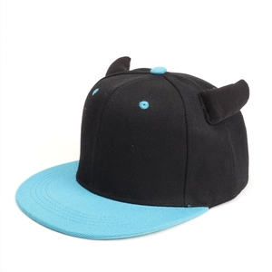 Detail of flat brim hip-hop hat with 3D demon horns and blue contrast peak