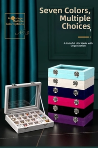 Detailed view of colorful velvet jewelry boxes with glass lids and metal buckles