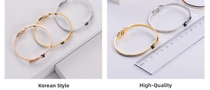 Detailed view of rhinestone inlaid bangles with buckle accent measuring 6cm inner diameter