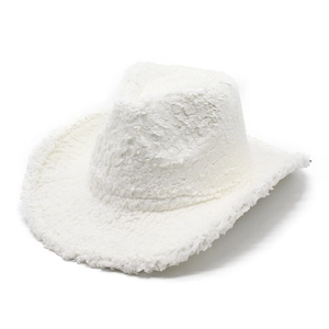 Detailed view of the fluffy white faux fur texture on a western cowboy style felt hat