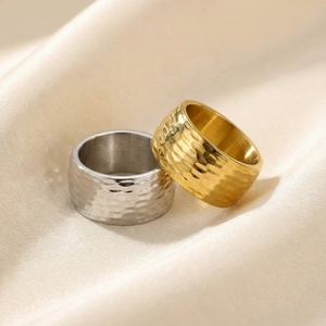 Minimalist stainless steel ring with hammered texture in gold and silver finishes