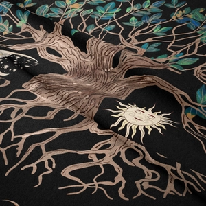 Close-up detail of Bohemian Tree of Life tapestry with soft velvet texture and celestial sun