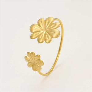 Gold brushed stainless steel open bangle featuring elegant sunflower petal designs