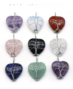 Grid view of nine heart-shaped natural crystal pendants with wire-wrapped tree of life