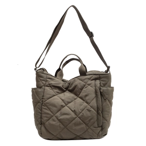 Olive green quilted tote bag with large diamond stitching and adjustable shoulder strap
