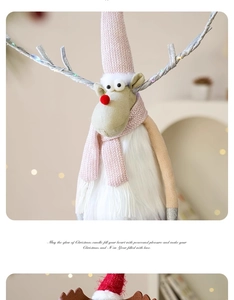 Close-up of plush Christmas reindeer with pink knit hat and warm bokeh light background