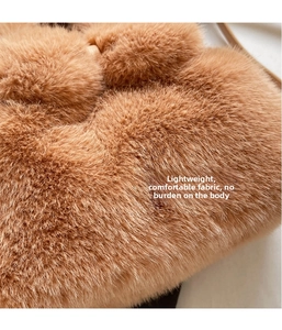 Detailed macro view of soft brown faux fur texture on the stylish bucket handbag