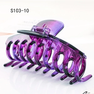 Close-up of a large purple plastic claw clip with glossy finish and durable teeth