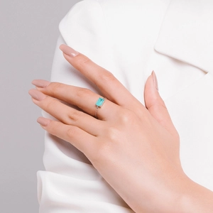 Adjustable S925 silver chain ring with rectangular blue tourmaline stone on a finger
