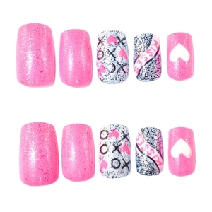 Pink glitter press-on nails set with XOXO and heart designs for Valentines Day style