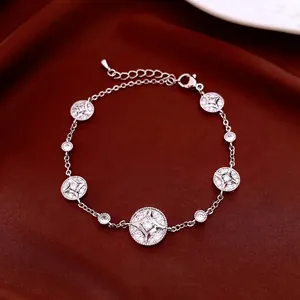 18K gold-plated adjustable bracelet with sparkling zircon charms on a red velvet background