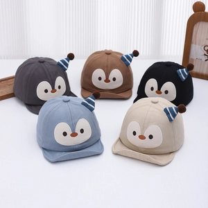 Cute penguin baby sun hats in five colors with soft brim and plush pom poms