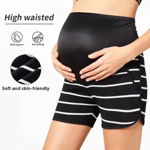 Detail view of maternity striped shorts featuring high waist belly support and side slit