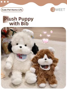 Detail of plush toy dogs in cream and caramel with floral bibs and white hats