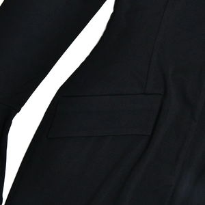 Detailed close-up showing the pocket stitching on this black long sleeve split dress