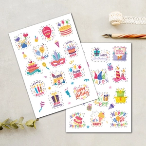 Close-up of Happy Birthday cartoon stickers with gold stamping for gift packaging and scrapbooking