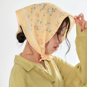 Floral cotton linen square scarf worn as a vintage headscarf in soft yellow color