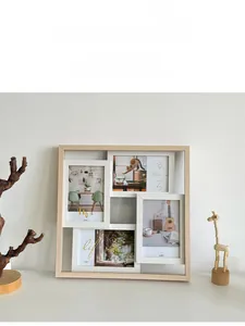 Detail of multi-photo wooden frame for four 4x6 inch photos with natural wood grain texture