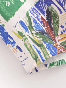 Detailed close-up of high-density fabric with abstract doodle print and precision stitching