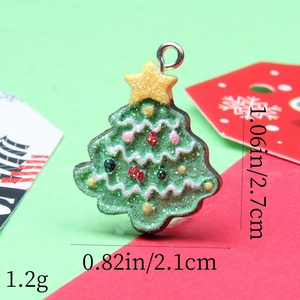 Detailed view of green glitter Christmas tree charm with dimensions 2.7cm by 2.1cm